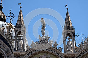 Statue of Saint, detail of the facade of the Saint Mark`s Basilica in Venice