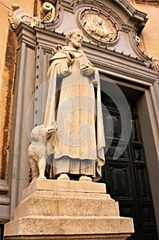 Statue of a saint with a dog near the Catholic Cathedral in the capital of Malta, Valletta.
