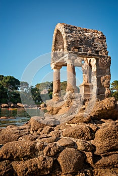 Statue of Saint Guirec on the beach of Ploumanach in Perros-Guirec, Côtes d\'Armor, Brittany France