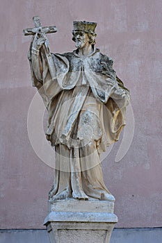 Statue Of Saint Holding Crucifix