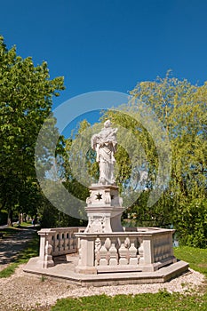 Statue of Saint John of Nepomuk in a park near Leopoldskroner Weiher lake, Salzburg, Austria
