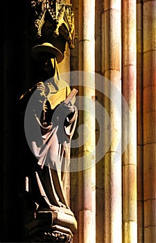 Statue of a saint in light and shadow