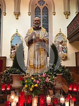 Statue of Saint Padre Pio with Eucharist