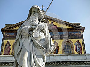 Statue of Saint Paul in front of the basilica of Saint Paul outside the walls to Rome in Italy.