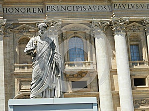 Statue of Saint Peter and Saint Peter's Basilica at St. Peter's