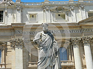 Statue of Saint Peter and Saint Peter's Basilica at St. Peter's