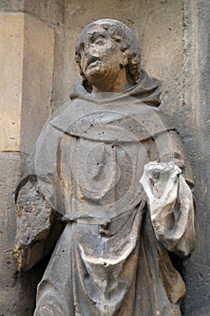 Statue of Saint on the portal of the Saint Germain l `Auxerrois church in Paris