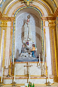 Statue representing Saint Peter inside the church of FajÃ£ de Santo Cristo. photo