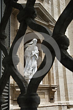Statue of Saint Teresa of Avila Viewed Through Fen
