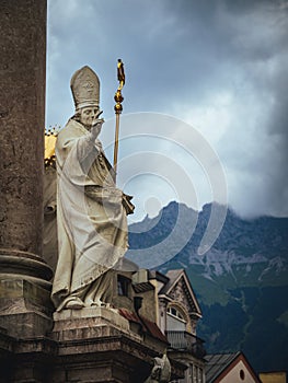 Statue of Saint Vigilius on St. Anne\'s column in Innsbruck, Tyrol, Austria