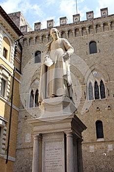 Statue of Sallustio Bandini 1677 - 1760, a priest and one of the first Italian economists, at Piazza Salimbeni, Siena, Italy