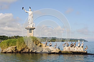 Statue of Salvador del mundo on the coast of Livingston