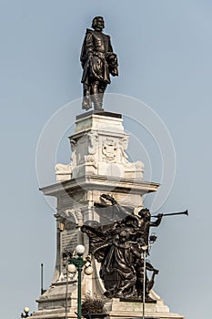 Statue of Samuel de Champlain against blue summer sky in historic area founder of Quebec City, Canada