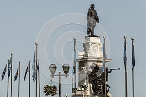 Statue of Samuel de Champlain against blue summer sky in historic area founder of Quebec City, Canada