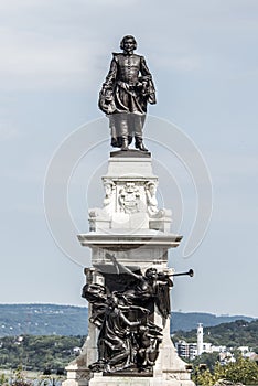 Statue of Samuel de Champlain against blue summer sky in historic area founder of Quebec City, Canada