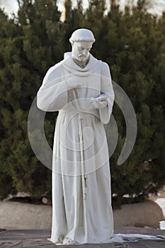 Statue of San Francisco De Asis in fornt of the Taos, New Mexico photo