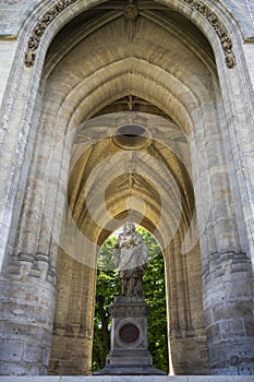 Statue and sculpture of Blaise Pascal at the base and center of the Saint-Jacques tour photo