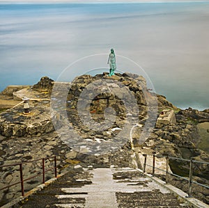 Statue of Selkie or Seal Wife in Mikladalur, Faroe Islands photo