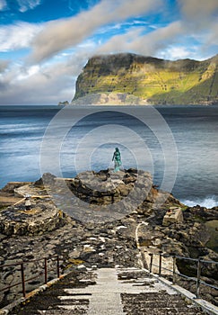 Statue of Selkie or Seal Wife in Mikladalur, Faroe Islands photo