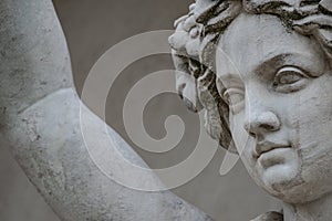 Statue of sensual busty and puffy renaissance era woman in circlet of flowers, Potsdam, Germany, details, closeup