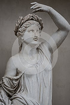 Statue of sensual Roman renaissance era woman in circlet of bay