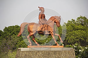 Statue Shivaji Maharaj riding on horse at Pune University campus, Pune, India