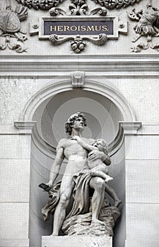 Statue shows an allegory of heroism, Burgtheater, Vienna photo
