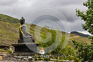 Statue of Siddhartha Gautam Buddha overlooking the Muktinath Village in Upper Mustang, Nepal