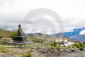 Statue of Siddhartha Gautam Buddha overlooking the Muktinath Village in Upper Mustang, Nepal