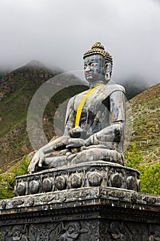 Statue of Siddhartha Gautam Buddha overlooking the Muktinath Village in Upper Mustang, Nepal