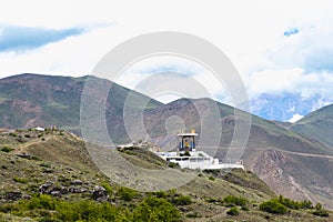 Statue of Siddhartha Gautam Buddha overlooking the Muktinath Village in Upper Mustang, Nepal