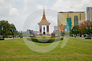 Statue of Sihanouk Norodom in lush green park in Phnom Penh, Cambodia