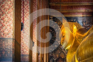 Statue of Sleep Buddha or Reclining Buddha in Wat Pho Temple in Bangkok, Thailand