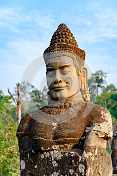 Statue of smiling face on South Bridge to Entrance of Angkor Thom, Khmer styled Temple, Siem Reap, Cambodia.