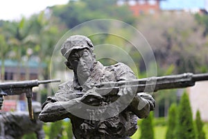 Statue of soldier shooting photo