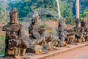 Statue south gate bridge angkor thom cambodia