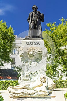 The statue of the Spanish famous painter Goya at the entrance to photo