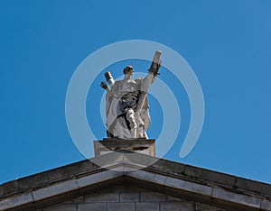 Statue of St. Andrew on the gable of a church