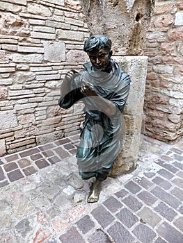 Statue of St. Francis in the garden of the monastery in Assisi,