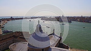 Statue of St. George standing on dome of cathedral, view of Grand Canal, Venice