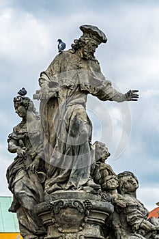 Statue of St. Ivo at the Charles bridge, Prague, Czech, The statue depicts the patron saint of lawyers who are accompanied by