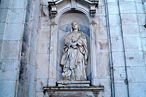Statue of St. Mary Magdalene de` Pazzi, decoration of the facade of the Estrela Basilica, Lisbon, Portugal photo