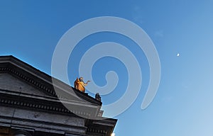 Statue of St. Theobald of Provins as a one of The 140 Saint Statues on the Colonnade pointing at moon on the St. Peter`s Square