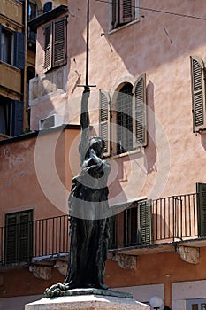 Statue Sword of Freedom on square Piazza delle Erbe in Verona