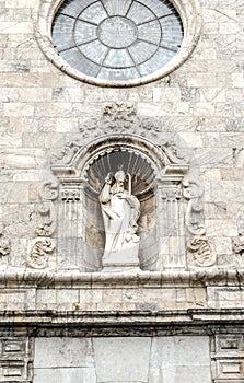 Statue of temple keeper of the Saint Nicholas Church in Malgrat photo