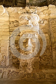 Statue on the Temple of the Masks at Kohunlich Mexico photo