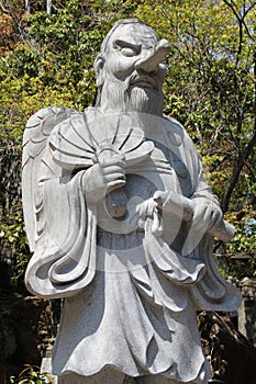 statue of a tengu in a buddhist temple (daisho-in) in miyajima (japan)