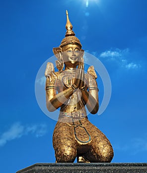 Statue of the Thai demon - security guard against the blue sky