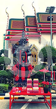 Statue of Thao Wessuwan for worship and faith in sacredness with ancient church in Thai temples.