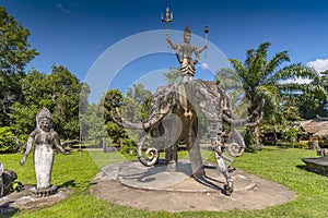 Statue of three headed elephant and warrior deity, Xieng Khuan Buddha Park, Vientiane, Laos